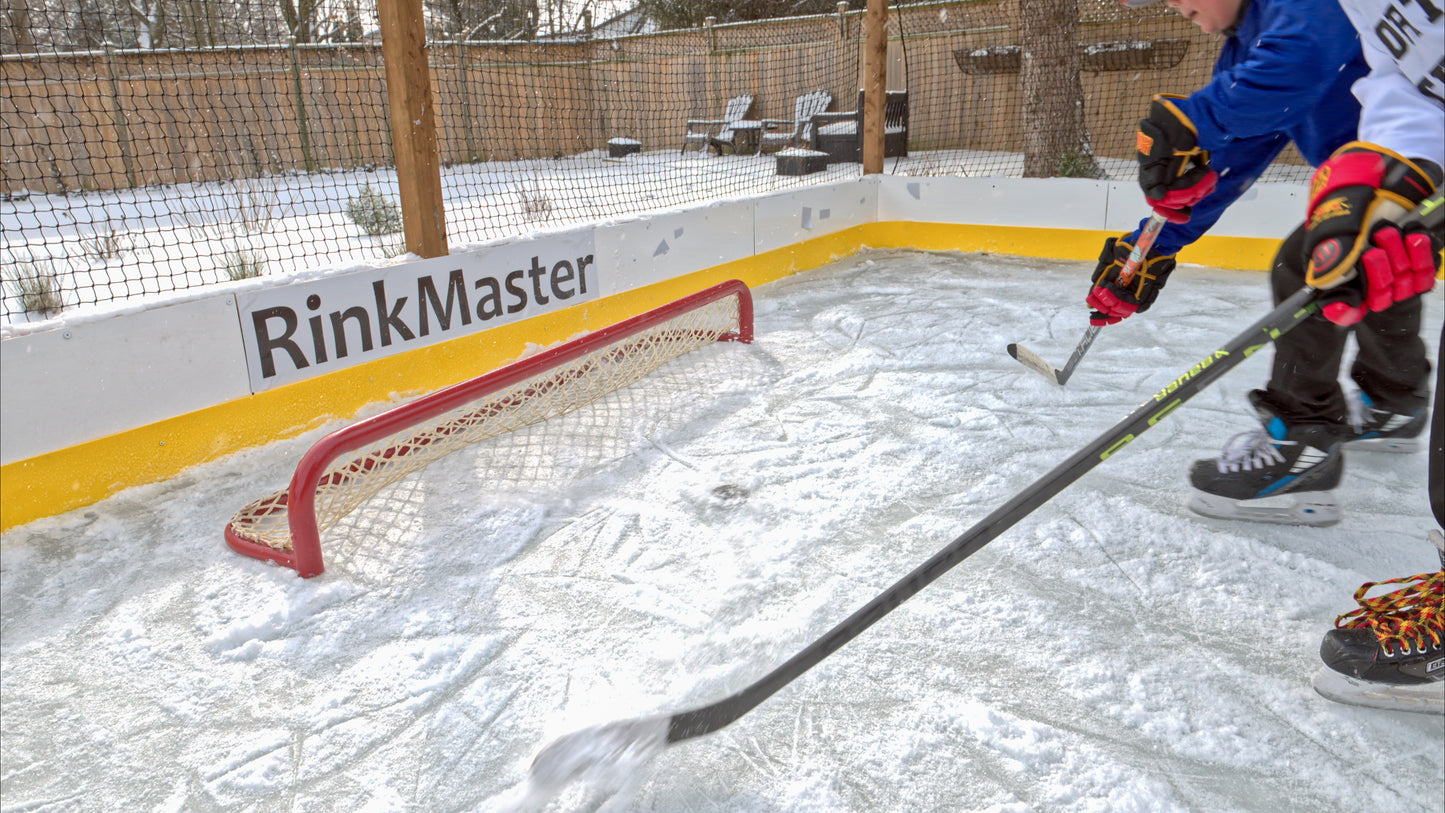 backyard ice rink with pond hockey net